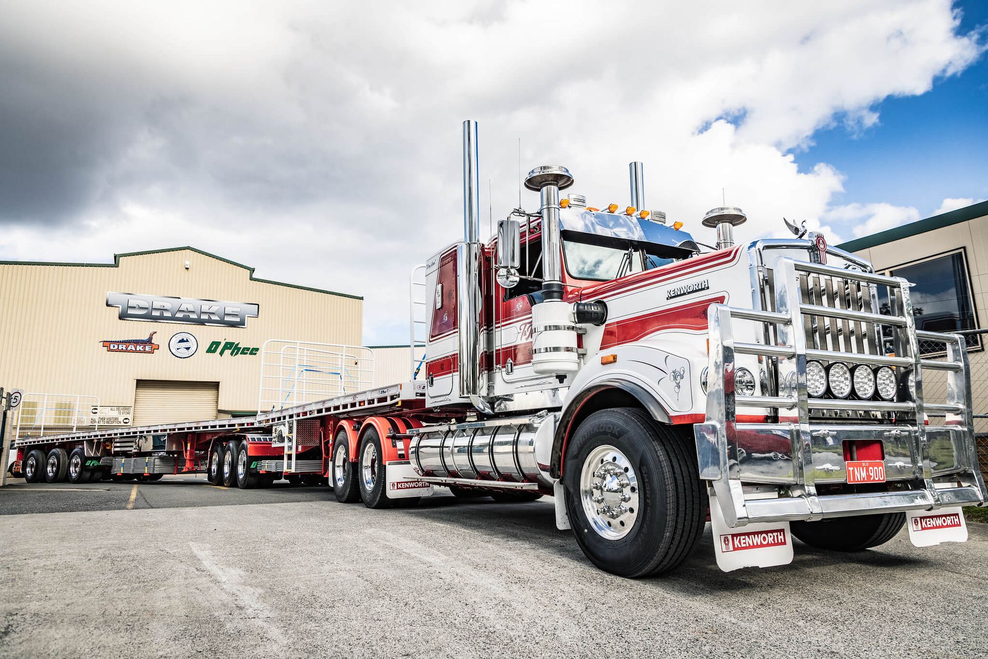 A bright red O'Phee B Double for T&M Earthmoving and Rural Contracting - showing off trailer length