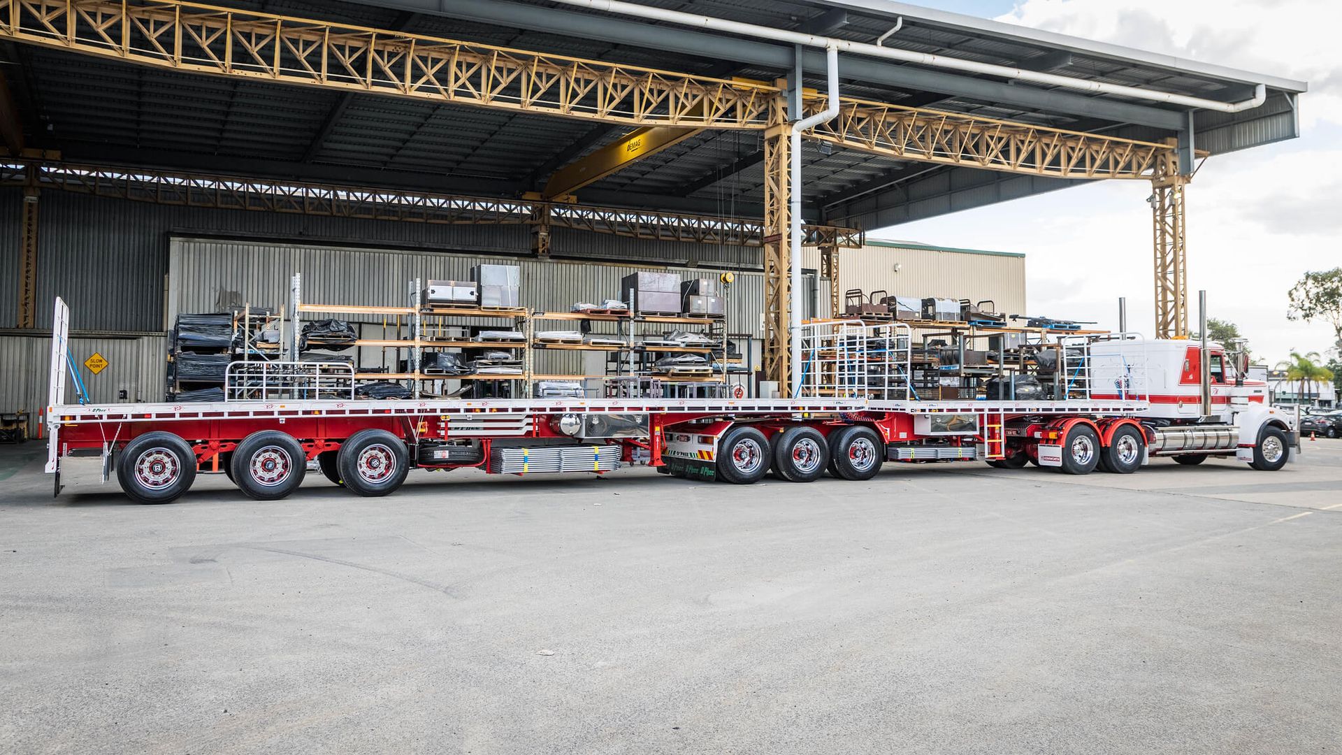 A bright red O'Phee B Double for T&M Earthmoving and Rural Contracting - showing off trailer length